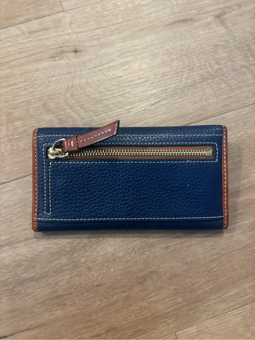 Dooney & Bourke Navy Pebbled Leather Wallet with Tan Trim and Wrist Strap